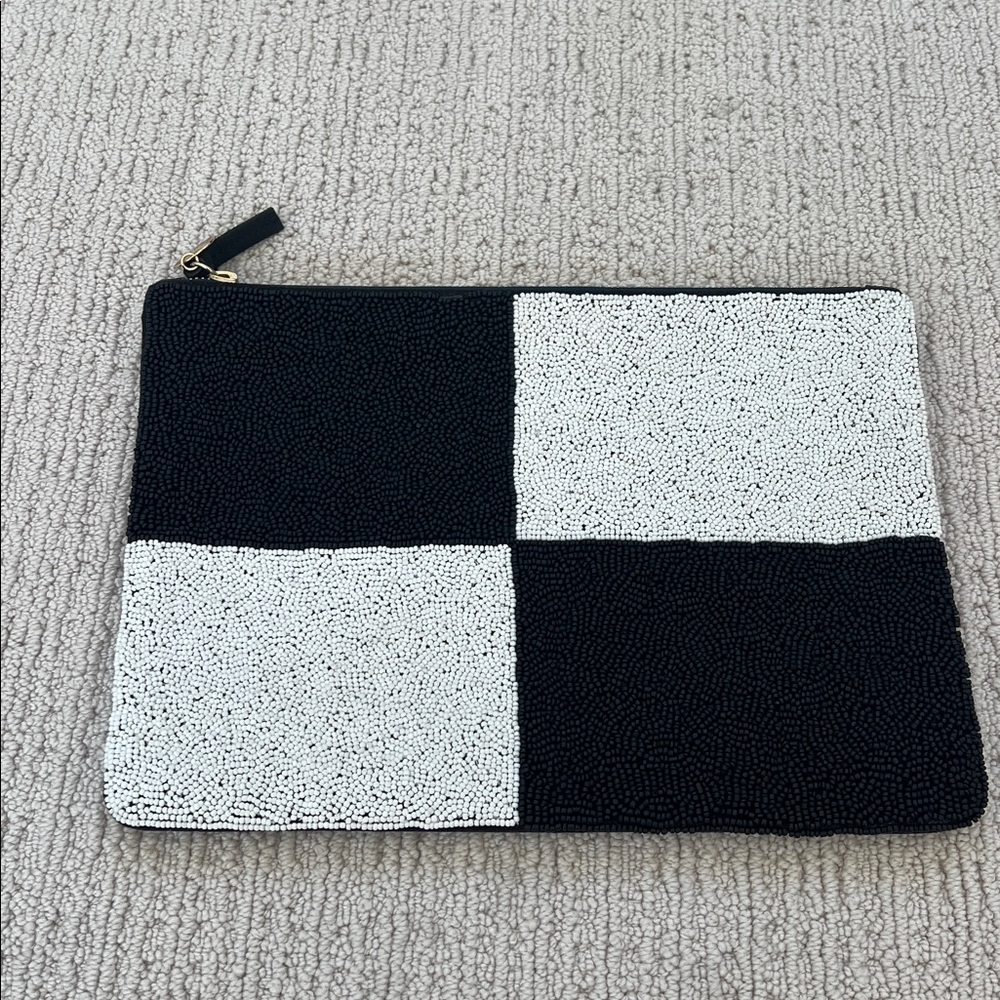 Clare V flat clutch.  Black/white beaded on front, black leather back.  Used 1x